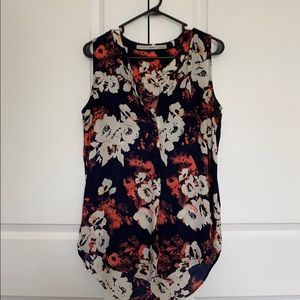 Gibson Sleeveless high low top.